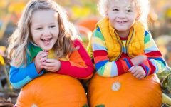 Kids Picking Pumpkins On Halloween Pumpkin Patch