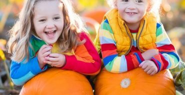 Kids Picking Pumpkins On Halloween Pumpkin Patch